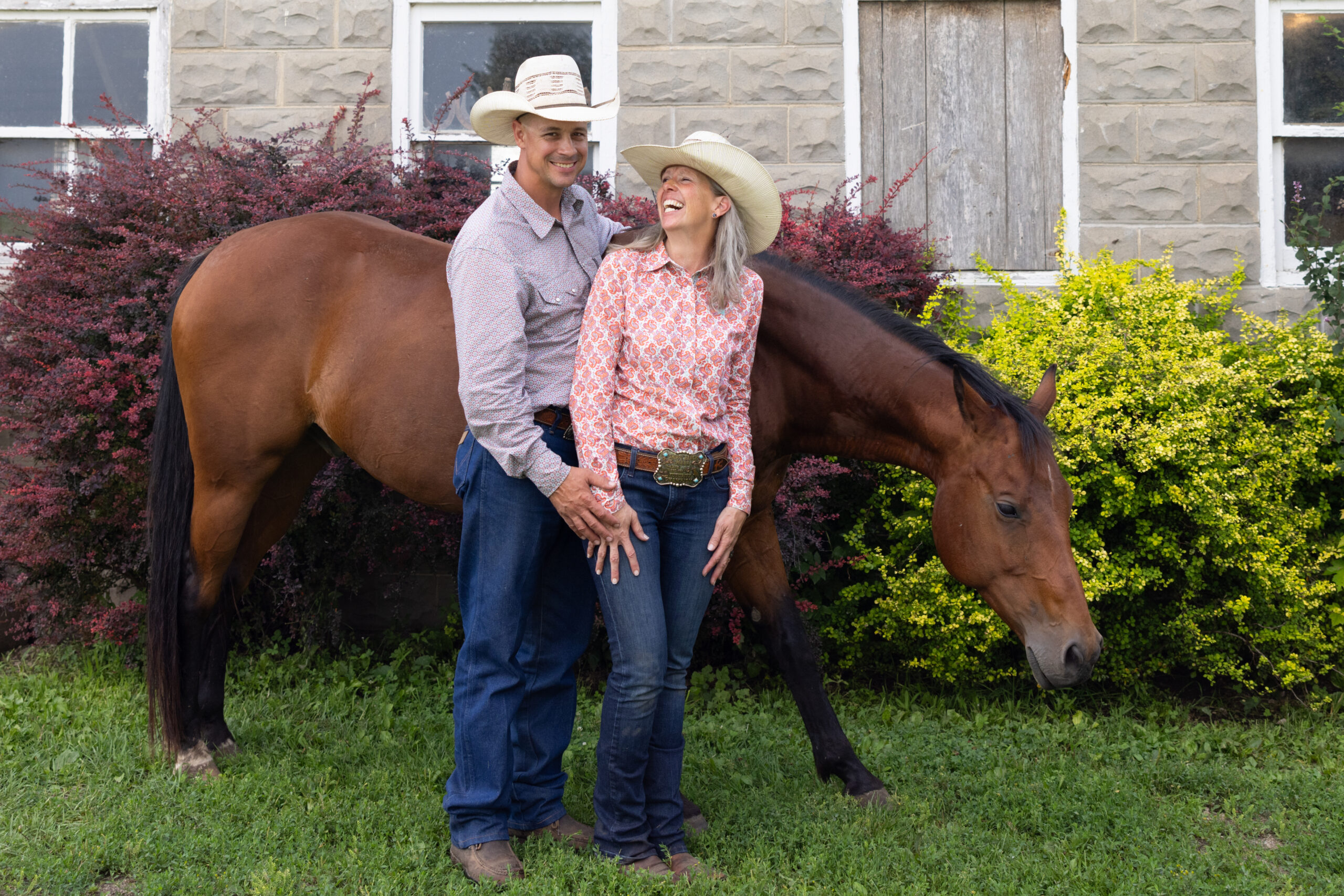 Dusten & Kim laughing and standing with Will